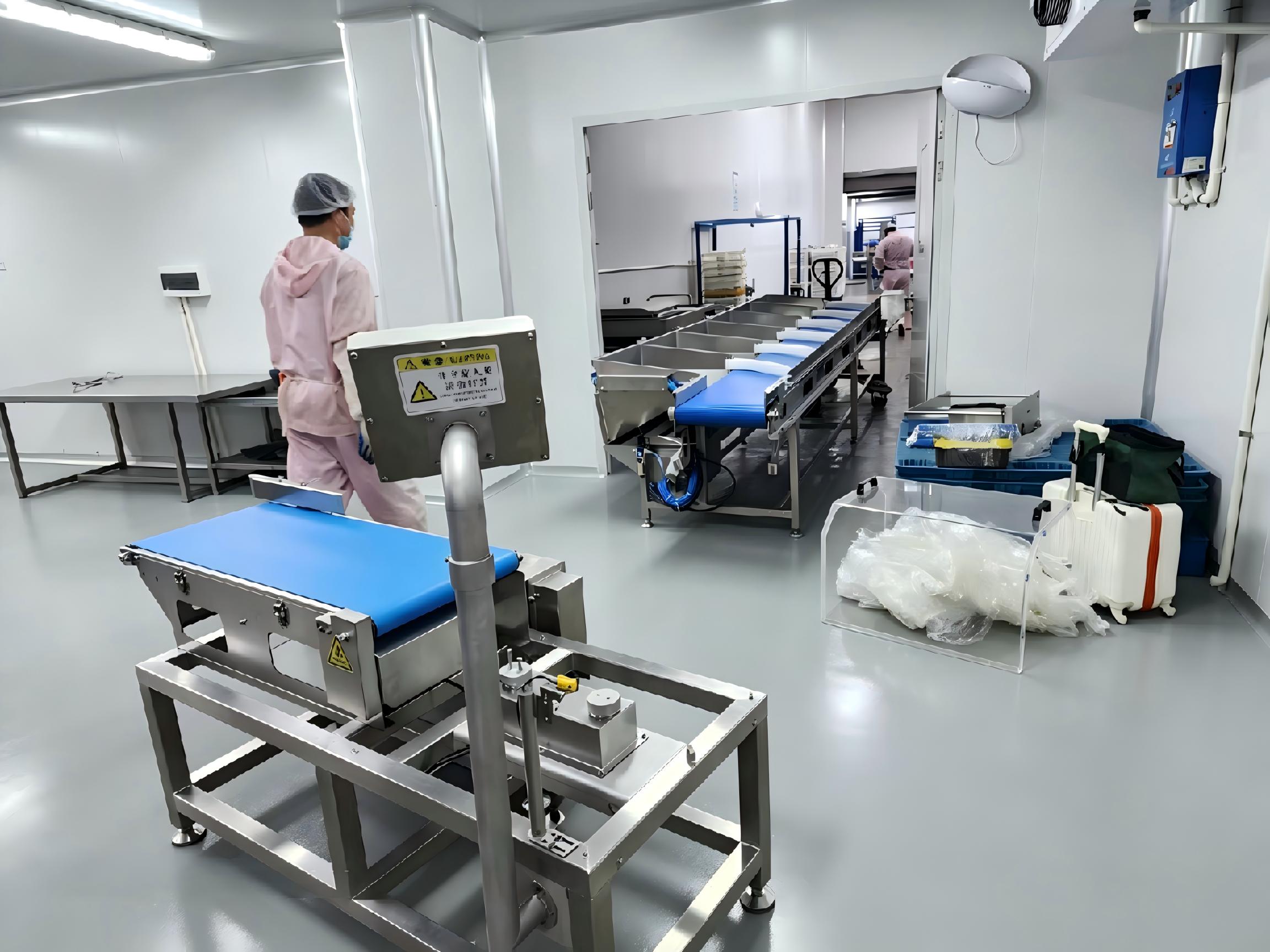 Automatic weight sorting machine installed in a real food processing factory for accurate weight grading